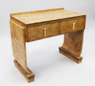 An Art Deco burr maple two drawer side table, with shaped end supports, each on a rectangular