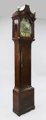 Thomas Jackson of London. A George III oak eight day longcase clock, the 12 inch arched brass dial