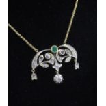 A 15ct gold, emerald and diamond drop pendant on a 9ct gold chain, of demi lune form with three