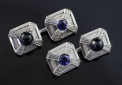 A pair of platinum and sapphire octagonal cufflinks, set with cabochon and round cut stones with a