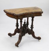 A Victorian burr walnut folding card table, with inverted shaped front, the folding top with a