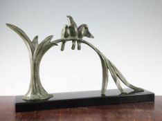 A French Art Deco patinated bronze group modelled as three birds sitting upon an arched leaf, on