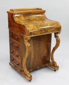 A Victorian burr walnut harlequin davenport, with pop-up stationery compartment and piano top with