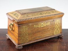 A Regency rosewood and brass inlaid sarcophagus shaped tea caddy, with quarter reel mouldings, the