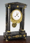 An early 19th century French ormolu mounted marble portico clock, with ormolu swag enamel dial,