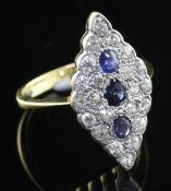A 1940's 18ct gold sapphire and diamond marquise shaped ring, set with old cut diamonds and round
