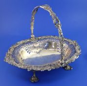An Edwardian silver oval cake basket by William Hutton & Sons Ltd, with pierced decoration and