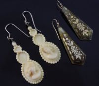 A pair of early 20th century drop earrings blonde tortoiseshell and pique earrings and a later