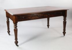 A Victorian mahogany writing table, with red leather and gilt tooled inset skiver, with four