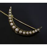 A Victorian style gold and diamond crescent brooch, set with fifteen graduated old cut diamonds,