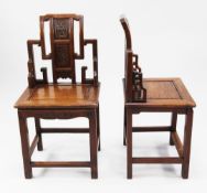 A pair of Chinese rosewood hall chairs, with traditional pierced shape backs with carved floral