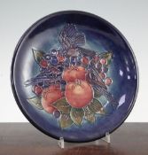 A Moorcroft Finches pattern baluster vase and a similar dish, post-war, both with graduated blue