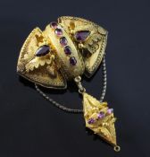 A Victorian gold and garnet drop pendant/brooch, of navette form, with foliate decoration and set