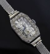 A lady's 1920's platinum and diamond manual wind cocktail watch, with octagonal Arabic dial with