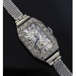 A lady's 1920's platinum and diamond manual wind cocktail watch, with octagonal Arabic dial with