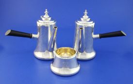 An early 20th century cased cafe au lait pair and sugar bowl, of cylindrical form with broad foot,