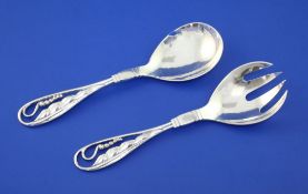 An early 1930's Georg Jensen sterling silver compote spoon and fork, design no.42, with pierced leaf