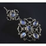 An early 20th century Arts & Crafts silver and moonstone drop pendant, of circular and cruciform