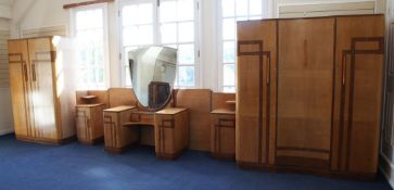 An Art Deco four piece maple and walnut bedroom suite, with stylish amber bakelite handles,