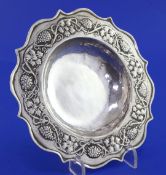 An Edwardian Arts & Crafts silver dish by the Keswick School of Industrial Art, of shaped circular