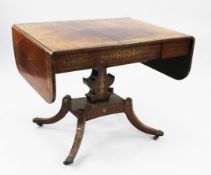 An early 19th century rosewood and cut brass inlaid sofa table, with single frieze drawer, the