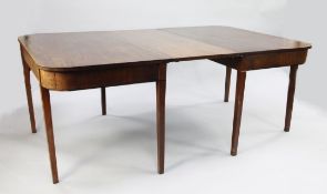 A George III mahogany dining table, with single extra leaf, on square section tapering supports,