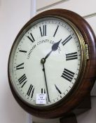 An early 20th century mahogany wall timepiece, with painted Roman dial signed London County