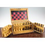 A Victorian games compendium, with leather covered board, containing Staunton style turned boxwood