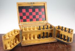 A Victorian games compendium, with leather covered board, containing Staunton style turned boxwood