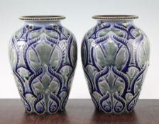 A pair of Doulton Lambeth stoneware ovoid vases, by Frank A. Butler, 1884, each decorated with
