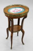 A Louis XV style oval two tier walnut and amboyna occasional table, with ormolu mounts, the top