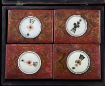 An Indian painted wood rectangular game box, containing four counter boxes, each lid mounted with