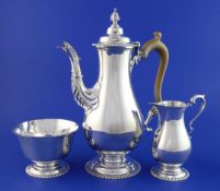A 1960's 18th century style silver three-piece coffee set by Mappin & Webb, of baluster form, with