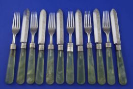 Six pairs of Indian? silver and green hardstone handled dessert eaters, with engraved arabesque