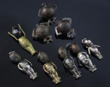 Six early 20th century metal and wooden "Fums Up" charms (four white metal and two brass) and