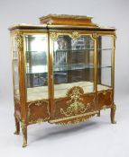 A late 19th century French ormolu mounted and kingwood stepped breakfront vitrine, with marble