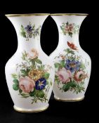 A pair of French enamelled opaline glass vases, mid 19th century, painted with floral bouquets, gilt