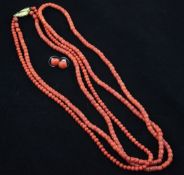 Two single strand coral bead necklaces and a pair of coral bead earrings, 18in with 18ct gold