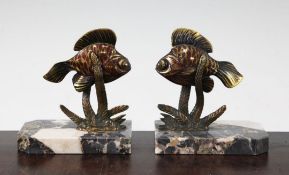 A pair of French Art Deco painted bronze bookends, modelled as fish amongst reeds, unsigned, on