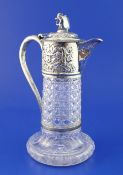 A late Victorian repousse silver mounted hobnail cut glass claret jug, with Bacchanalian