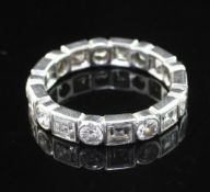 A 20th century platinum and diamond full eternity ring, set with alternating round brilliant and