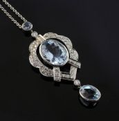 A white gold, diamond and aquamarine drop pendant necklace, of cartouche form, set with round and