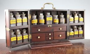 A Georgian mahogany apothecary box, with double hinged front and slide out panel back, opening to