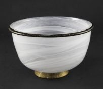 A Murano glass bowl, by Barovier & Toso, the bowl of swirled white and clear glass, with applied
