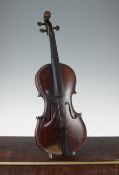 A 19th century German violin, with carved lion-head scroll, together with a nickel mounted bow and