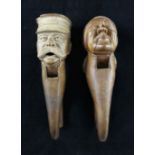 A pair of carved beech nutcrackers, modelled as a gent with peaked cap and large moustache, possibly