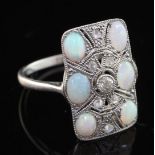 A 1920's platinum, white opal and rose cut diamond set tablet ring, with pierced millegrain setting,