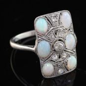 A 1920's platinum, white opal and rose cut diamond set tablet ring, with pierced millegrain setting,