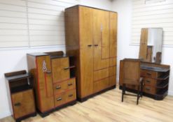 An Art Deco walnut and ebonised five piece bedroom suite, by Raleigh Furniture, includes a wardrobe,