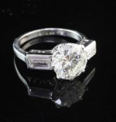 An early to mid 20th century platinum and single stone diamond ring with baguette cut diamond set